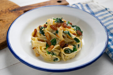 Pasta with chard and raisins. Traditional Italian recipe.