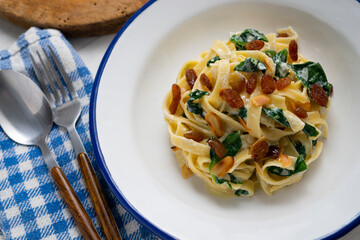 Pasta with chard and raisins. Traditional Italian recipe.