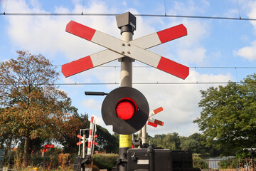 Red light sign at railroad crossing in Waddinxveen