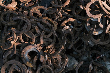Full Frame Shot Of Rusty Old Metal Horseshoes  - Powered by Adobe