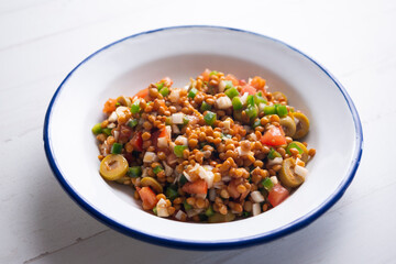 Lentil salad, cod, green pepper and onion.