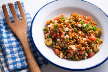 Lentil salad, cod, green pepper and onion.