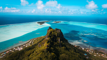 Mount Teurafaatiu summit view to blue Pacific ocean. View to atoll, blue laguna and sky. Maupiti island in French Polynesia. - obrazy, fototapety, plakaty