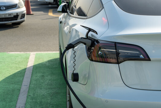 Tesla Electric Vehicle Only Charging Station Sign For Environmentally Friendly Vehicles In Parking Lot In Middle East.