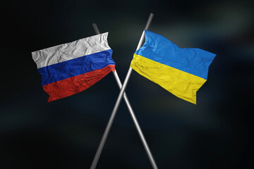 Ukraine Russia 2022 war conflict crisis concept. Ukrainian and russian flag on black background. 