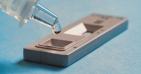 Liquid drops into cassette of Coronavirus Covid-19.