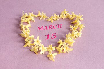 Calendar for March 15: number 15, the name of the month of March in English in a heart made of...