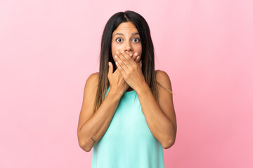 Caucasian girl isolated on pink background covering mouth with hands
