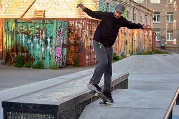 skateboarder prepares to jump on the parapet