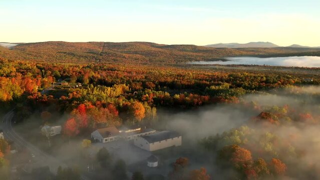 Breathtaking hyperlapse aerial shot low lying cloud over Fall colored landscape 