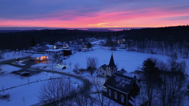 Amazing vibrant sunrise lights up the sky above Monson Town, Maine 