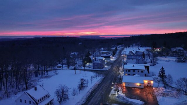 Wide aerial over Monson Town, Maine beautiful Winter sunrise 