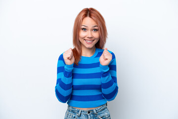 Young Russian girl isolated on white background celebrating a victory in winner position