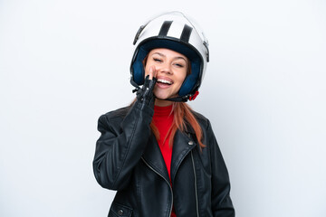 Young Russian girl with a motorcycle helmet isolated on white background shouting with mouth wide open