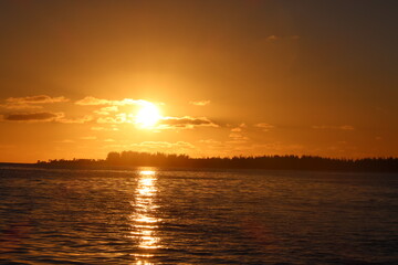 sunset over the sea in Tetiaroa in a pacific island fron French Polynesia 