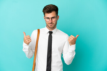 Business man over isolated background with thumbs up gesture and smiling