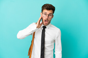 Business man over isolated background with surprise and shocked facial expression