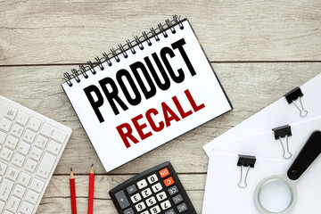 Product Recall. Business concept. text on notepad with pen on wooden background
