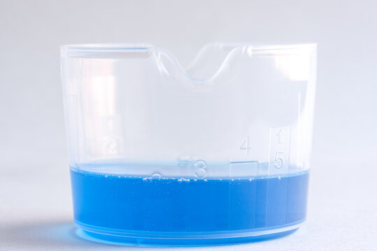 Liquid Laundry Detergent in a Measuring Cup