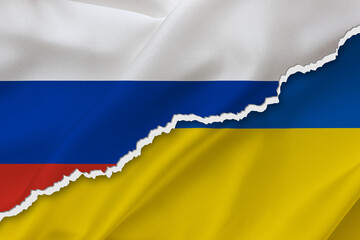 Ukraine and Russia waving silk flag ripped paper background. Ukraine war. Russia attacks to Ukraine. 