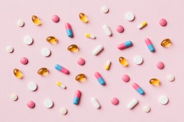 Many different pills and space for text on colorful background, top view. Different pills on color background, flat lay