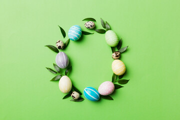 round frame Multi colors Easter eggs on colored background . Pastel color Easter eggs holiday concept with empty space for you design