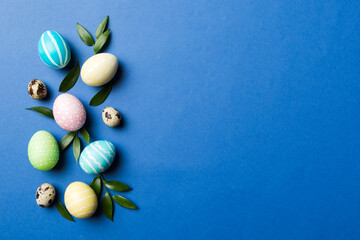 Colorful Easter eggs with spring flower leaf isolated over white background. Colored Egg Holiday border