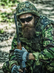 Ukraine war. Tired soldier. Military conflict, geopolitical concept. Army soldier with assault...