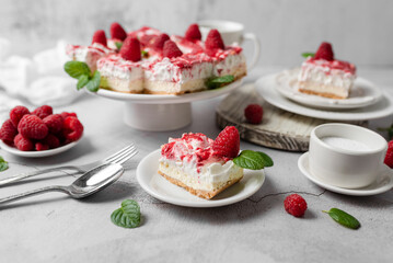 Raspberry bar cheesecake with whipped topping and fresh raspberries. tasty dessert. 