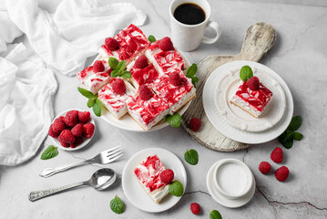 Raspberry bar cheesecake with whipped topping and fresh raspberries. tasty dessert. 