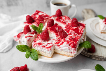 Raspberry bar cheesecake with whipped topping and fresh raspberries. tasty dessert. 