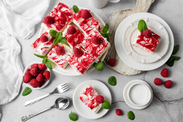 Raspberry bar cheesecake with whipped topping and fresh raspberries. tasty dessert. 