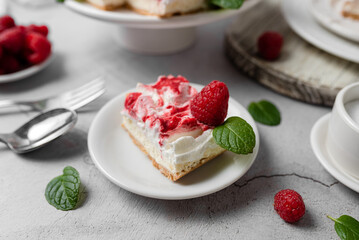 Raspberry bar cheesecake with whipped topping and fresh raspberries. tasty dessert. 
