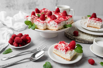 Raspberry bar cheesecake with whipped topping and fresh raspberries. tasty dessert. 