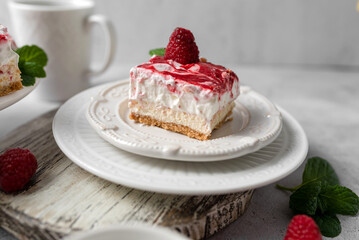 Raspberry bar cheesecake with whipped topping and fresh raspberries. tasty dessert. 