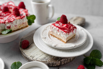 Raspberry bar cheesecake with whipped topping and fresh raspberries. tasty dessert. 