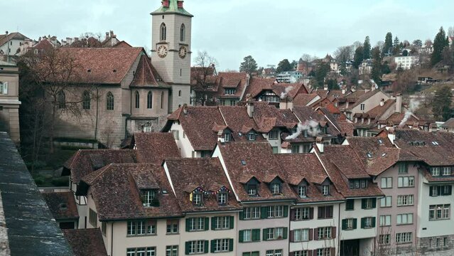 Beautiful old roofs of Bern the Capital of Switzerland. A view from above of old medieval historical Swiss architecture.