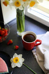 Spring fresh morning. Light breakfast and flowers for a good mood for the whole day. Composition of fruits, flowers and sweets for tea.
