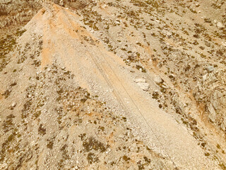 sandy high mountain. high mountain with plants. sand from stones, small granite rocks. vacation in the mountains. relaxation in nature