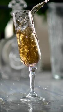 Champagne Glass breaks in slow motion close up