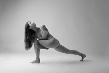 Woman doing a Yoga pose. black and white photo