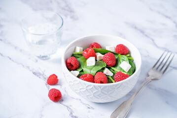 Spinach raspberry Feta salad in a bowl