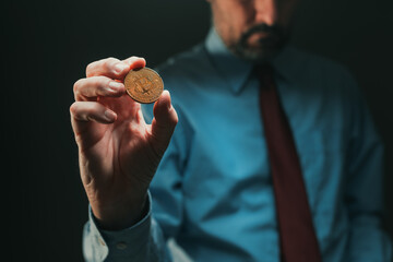 Bitcoin cryptocurrency broker holding coin