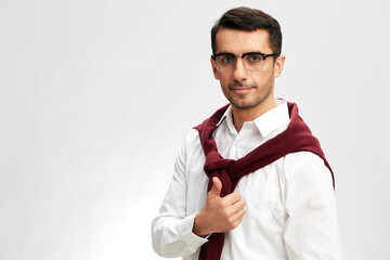 handsome man red sweater on shoulders glasses lifestyle business and office concept