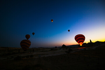 Silhouette of Hot Air Balloons at sunrise in Cappadocia.