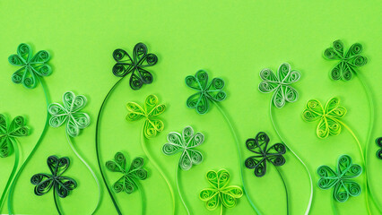Shamrock leaves background in quilling technique for St. Patrick's Day. Green clover leaves for St....