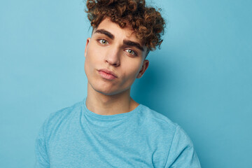 Fototapeta premium handsome guy in blue t-shirts with a pumped-up body unaltered