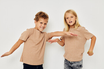 Boy and girl gesticulate with their hands together childhood unaltered