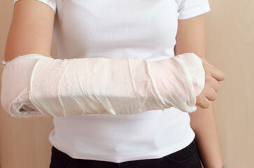 plaster bandage on the women right arm in interior