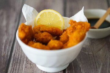 Crispy Fried Chicken Garnished with Lemon